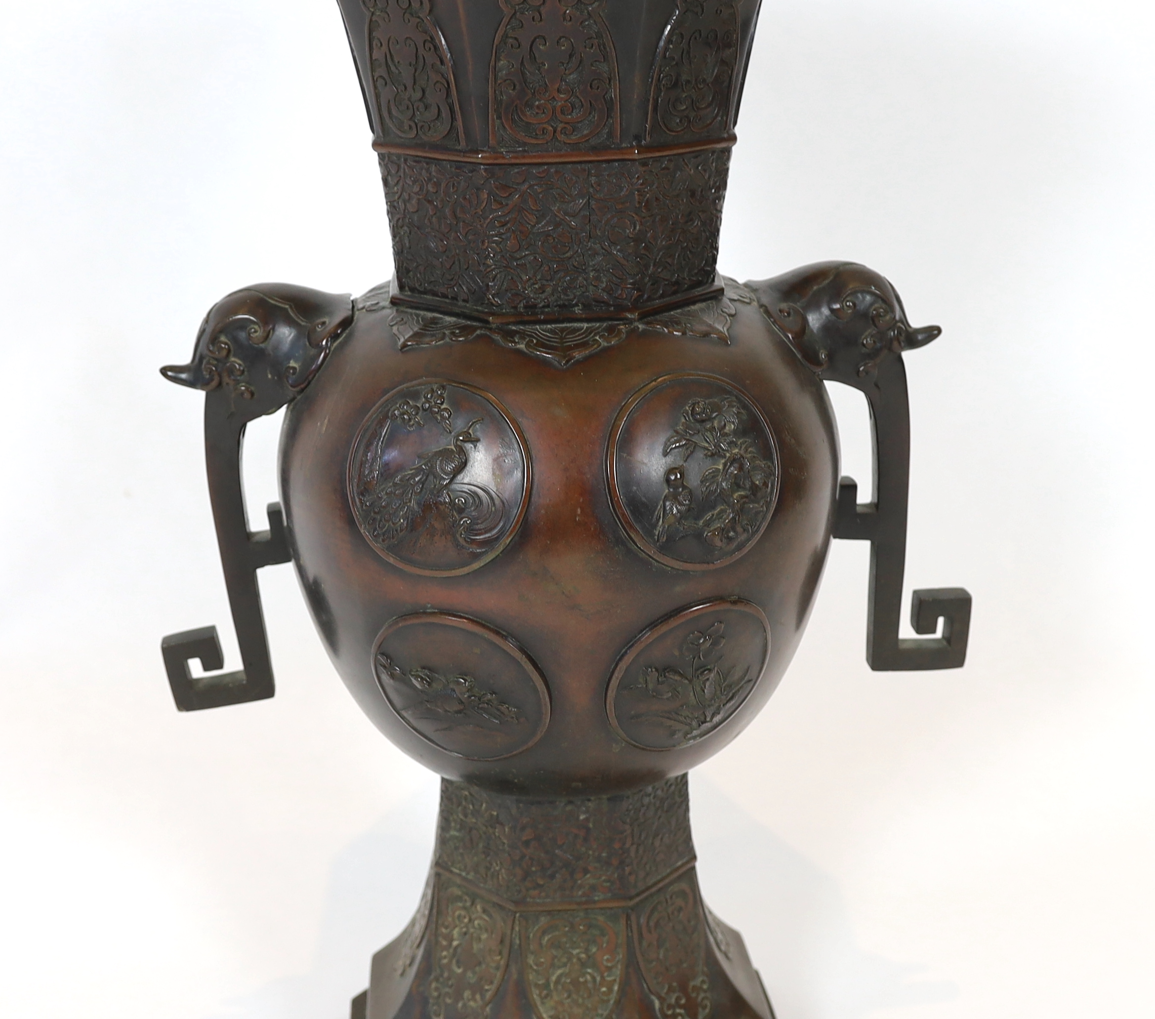 A tall Japanese archaistic bronze octagonal vase, Meiji period, base panel lacking